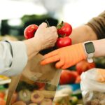 Hands Holding Bag and Tomatoes